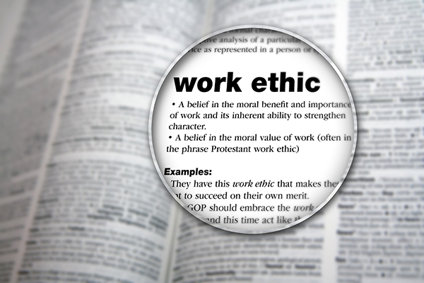 work ethic words are seen through a magnifying glass